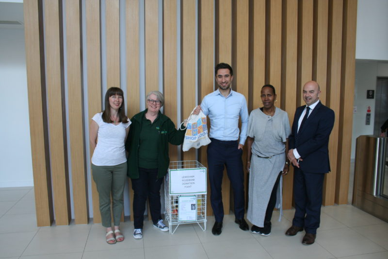 Damien Egan, Mayor of Lewisham; Carol Bosridge, Lewisham Food Bank, and Council staff dropping off food bank donations at Lewisham Town Hall